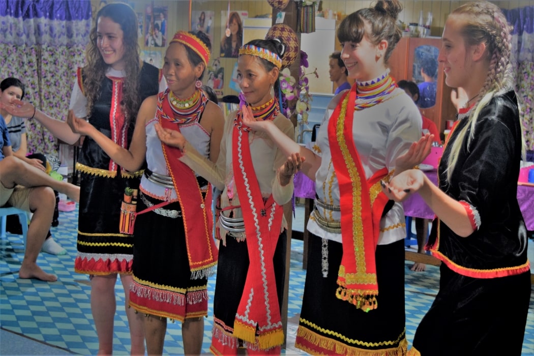 Trying out Bidayuh traditional costumes in Kuching with Backyard Tour Malaysia