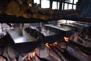 Firewood is burnt 24 hours to get the salt dry with Backyard Tour Malaysia