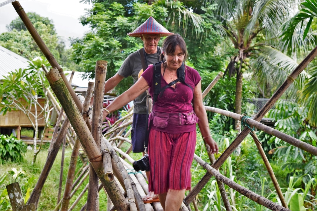 Walking around the village using the bamboo bridge with Backyard Tour Malaysia