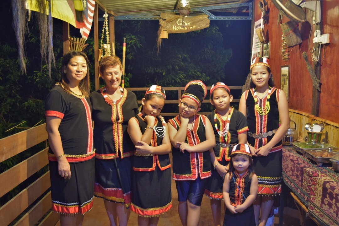 Trying out Bidayuh traditional costume with Backyard Tour Malaysia